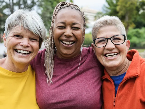 3 senior women smiling together