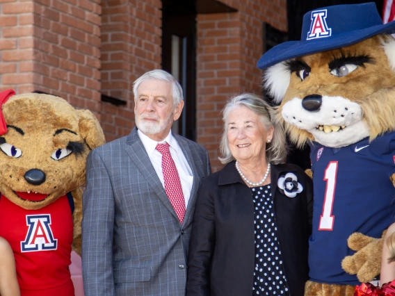 Bruce and Patricia Bartlett with Wilma and Wilbur Wildcat and cheerleaders