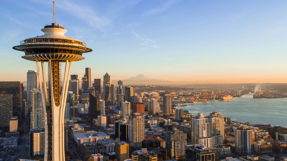 Cityscape of Seattle featuring the Space Needle, skyscrapers, and sea