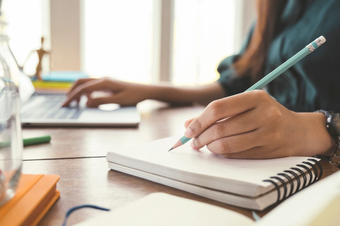 Woman writing at a desk