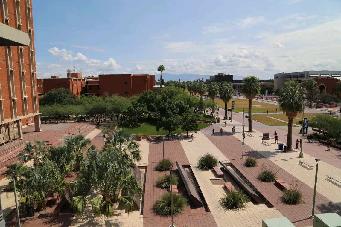 Landscape of the Administration building, trees, fountains, and sky