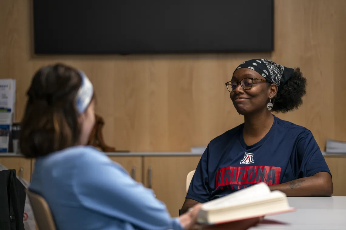 Students seated chatting in a class