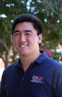 Man in navy blue SALT Center polo with trees in the background.