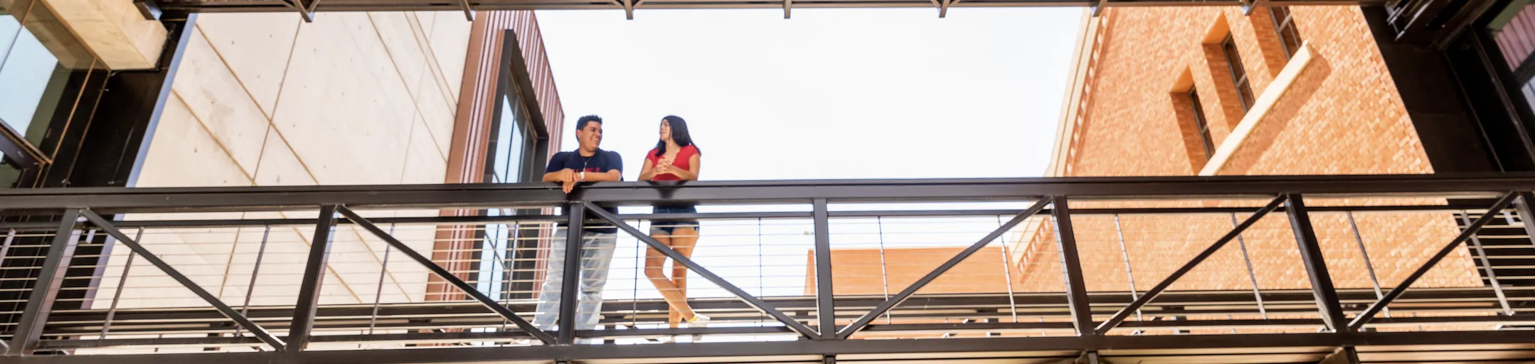 2 students standing outside of the Bartlett Labs