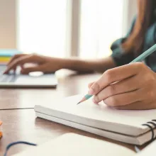 Woman writing at a desk