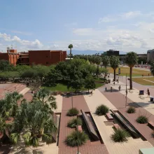 Landscape of the Administration building, trees, fountains, and sky