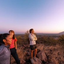 Photo of 3 UofA Student on top of Tumamoc Hill